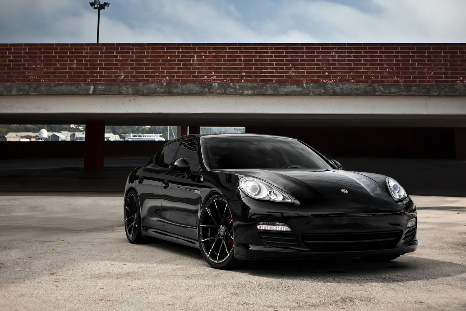 Black Panamera on black and white Stuttgart wheels